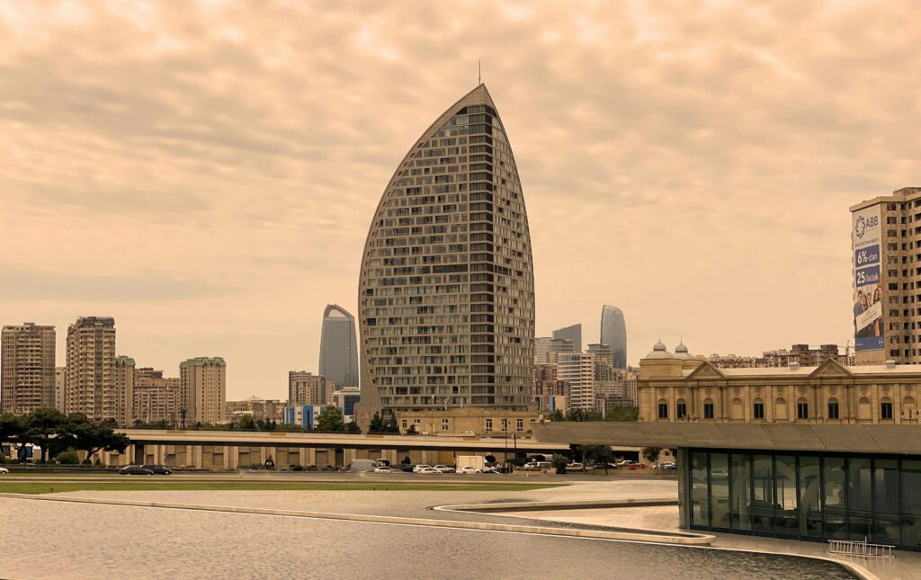 pexels-photo-18312992-18312992 Cityscape of Baku with modern architecture against a cloudy sky.